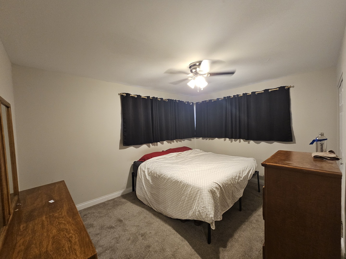 3114 West 163rd Street Markham, IL 60428 - Photo 12 of 16 a bed sitting in a bedroom and chandelier