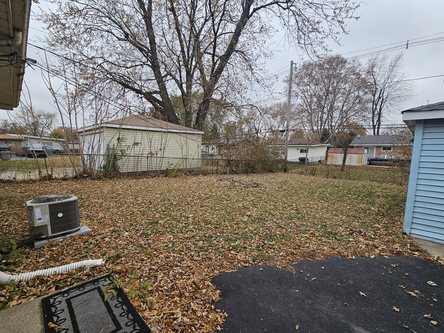 3114 West 163rd Street Markham, IL 60428 - Photo 16 of 16 a view of a yard with a house and a tree