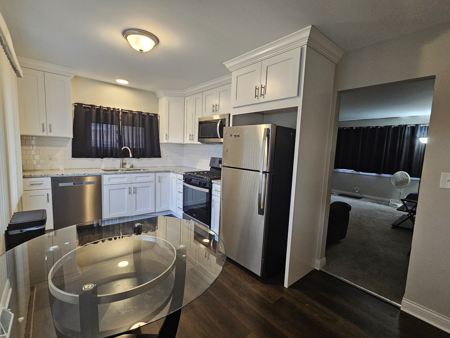 3114 West 163rd Street Markham, IL 60428 - Photo 6 of 16 a kitchen with refrigerator and microwave