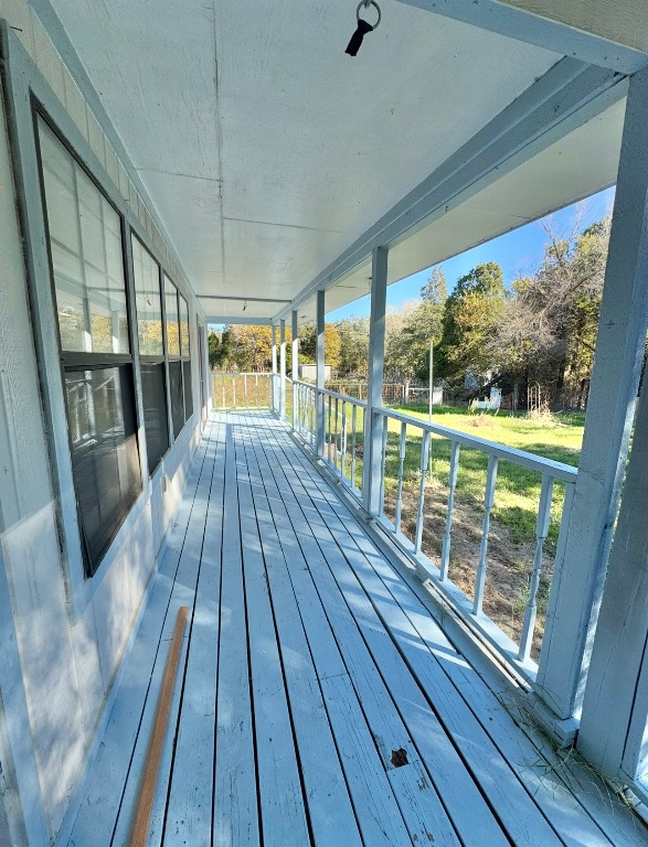 233 Farm To Market 696 Elgin, TX 78621 - Photo 22 of 28 a view of a balcony with wooden floor