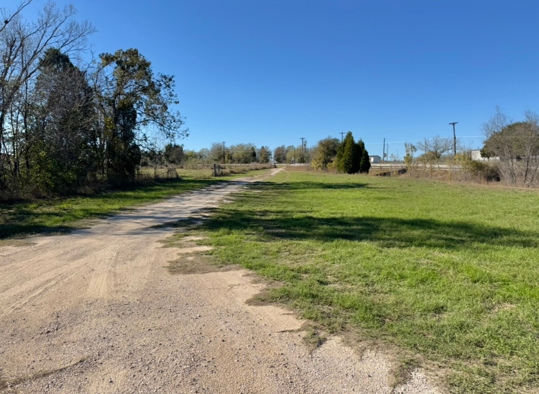 233 Farm To Market 696 Elgin, TX 78621 - Photo 28 of 28 a view of a field with an trees