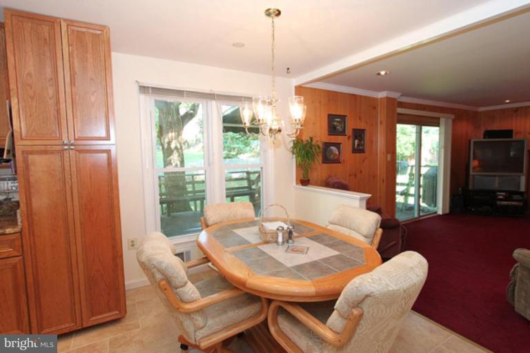 12504 Arbor View Terrace Silver Spring, MD 20902 - Photo 10 of 18 a view of a dining room with furniture window and outside view