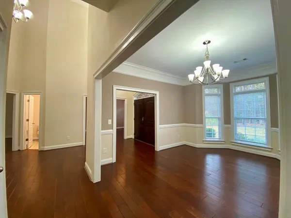 en view of an empty room with a ceiling fan