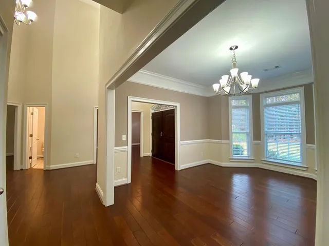 en view of an empty room with a ceiling fan