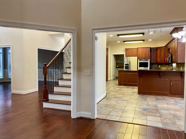 an empty room with a empty space and a ceiling fan