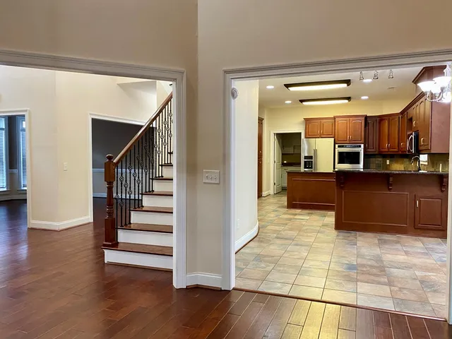 an empty room with a empty space and a ceiling fan