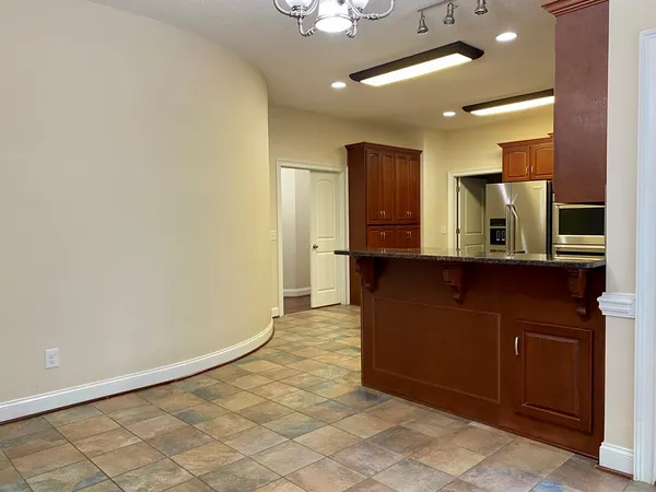 a view of an empty room with a large window