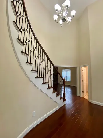 an empty room with a kitchen and a sink