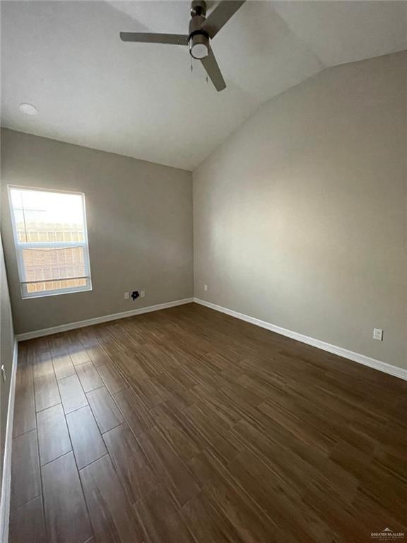 509 Sparrow Road, Unit 3 Weslaco, TX 78596 - Photo 15 of 19 an empty room with wooden floor and windows