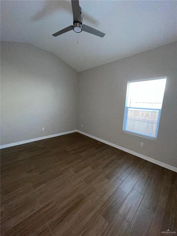 509 Sparrow Road, Unit 3 Weslaco, TX 78596 - Photo 16 of 19 a view of an empty room with wooden floor and a window