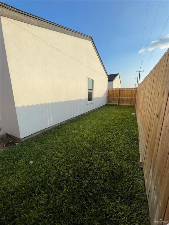509 Sparrow Road, Unit 3 Weslaco, TX 78596 - Photo 19 of 19 a view of a backyard with plants