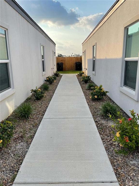 509 Sparrow Road, Unit 3 Weslaco, TX 78596 - Photo 3 of 19 a view of back yard of the house