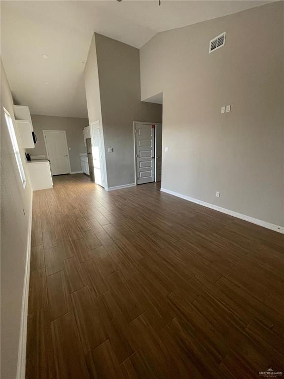 509 Sparrow Road, Unit 3 Weslaco, TX 78596 - Photo 5 of 19 wooden floor in an empty room