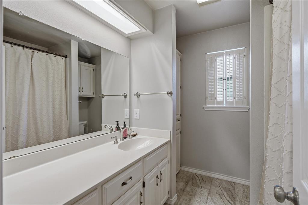 108 Granada Square Canton, TX 75103 - Photo 6 of 11 a bathroom with a sink and a mirror