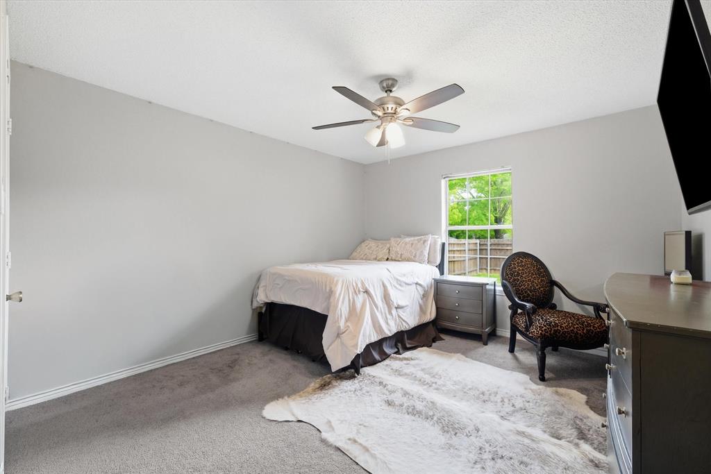 108 Granada Square Canton, TX 75103 - Photo 7 of 11 a bed room with a bed window and a chair