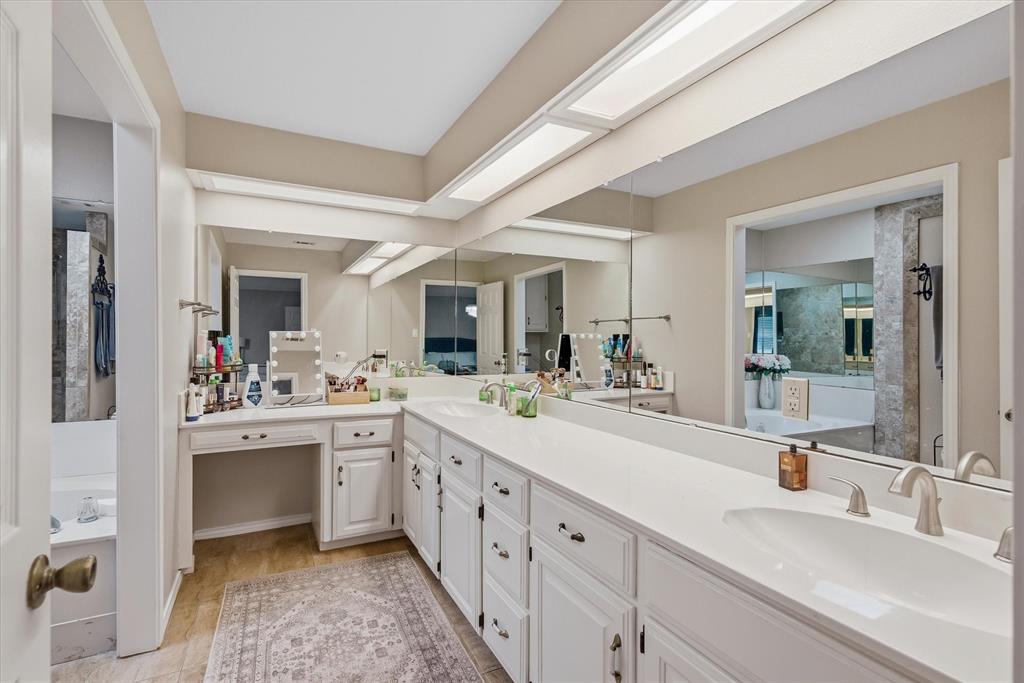 108 Granada Square Canton, TX 75103 - Photo 9 of 11 a spacious bathroom with a double vanity sink and mirror