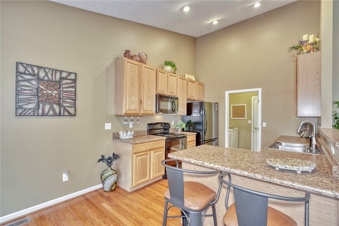 1082 Railway Crossing Webster, NY 14580 - Photo 11 of 43 KITCHEN WITH QUALITY CABINETRY * VAULTED CEILING