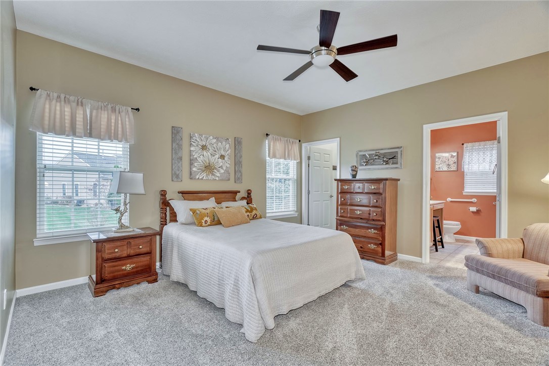 1082 Railway Crossing Webster, NY 14580 - Photo 15 of 43 1ST FLOOR PRIMARY BEDROOM WITH ENSUITE