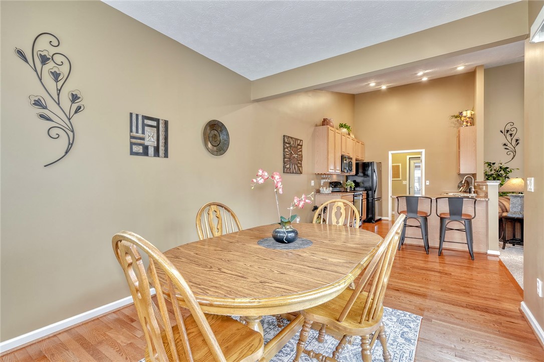 1082 Railway Crossing Webster, NY 14580 - Photo 8 of 43 DINING ROOM VIEW TO KITCHEN BREAKFAST BAR