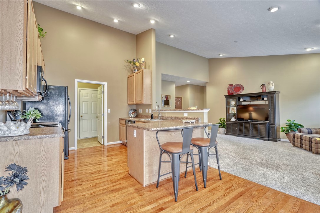 1082 Railway Crossing Webster, NY 14580 - Photo 10 of 43 KITCHEN BREAKFAST BAR *HARDWOOD FLOOR