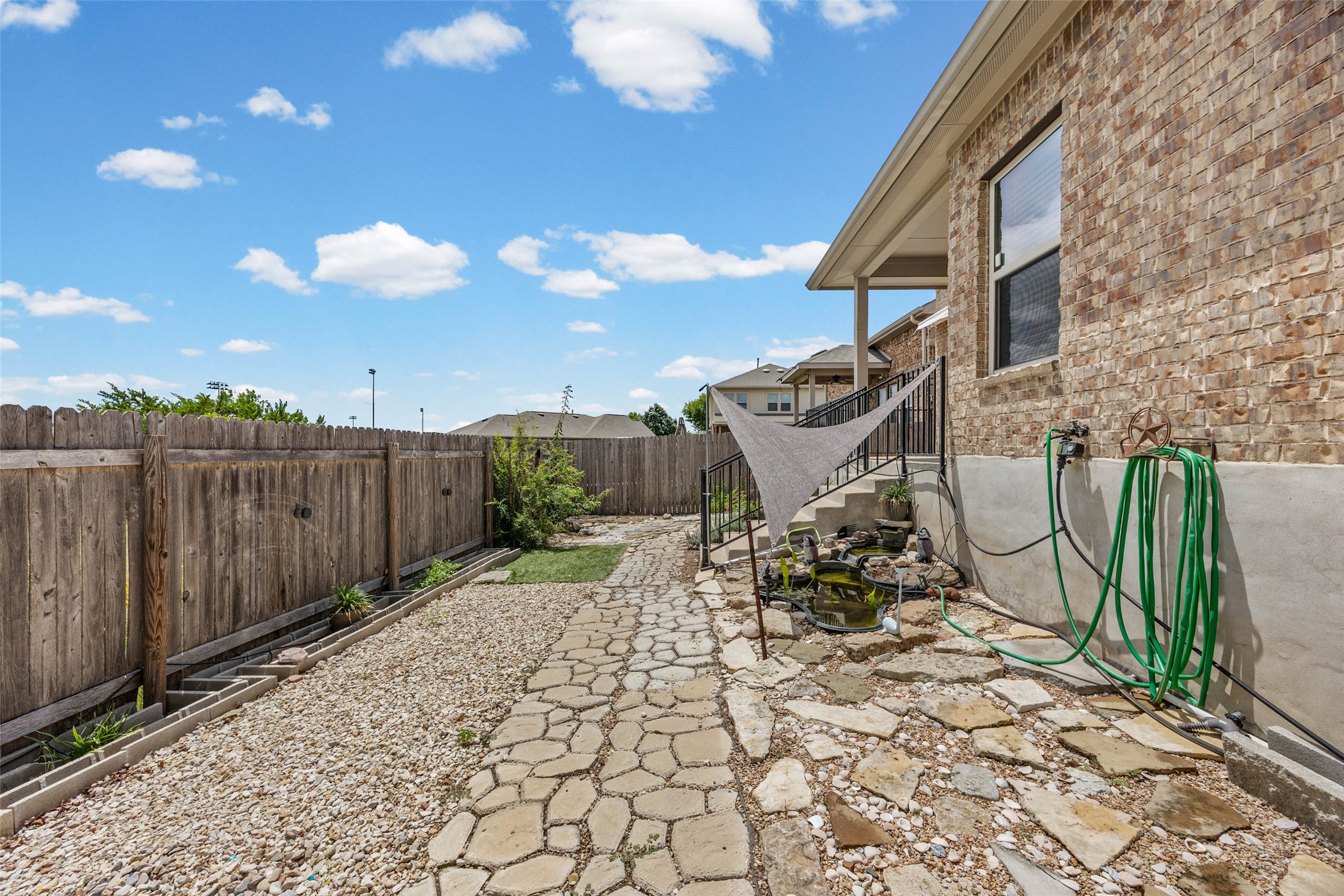 536 Rancho Verde Drive Leander, TX 78641 - Photo 29 of 37 a view of a chairs and table in backyard