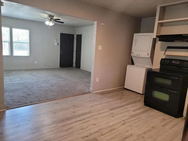 wooden floor in an empty room with a fireplace