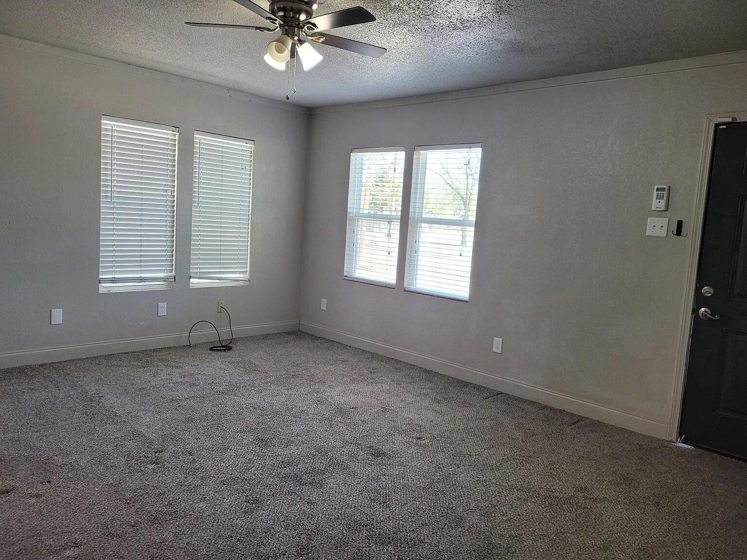 2404 Avenue U, Unit FRONT Lubbock, TX 79411 - Photo 3 of 10 a view of an empty room with a window