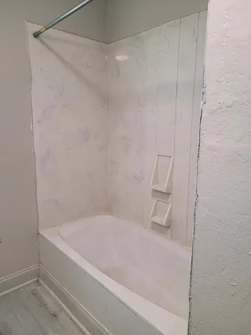 a bathroom with a bathtub