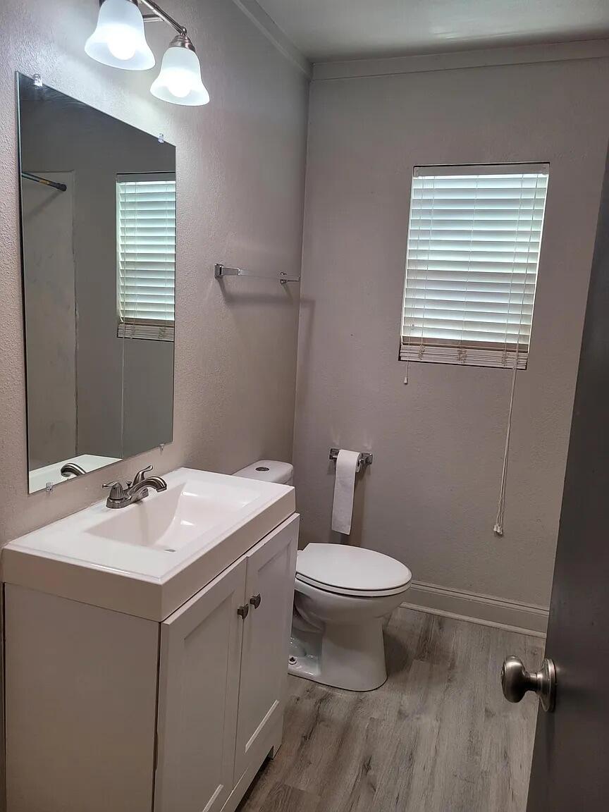 2404 Avenue U, Unit FRONT Lubbock, TX 79411 - Photo 10 of 10 a bathroom with a sink toilet and mirror