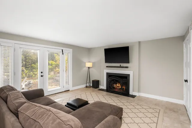 a bedroom with a bed and a fireplace