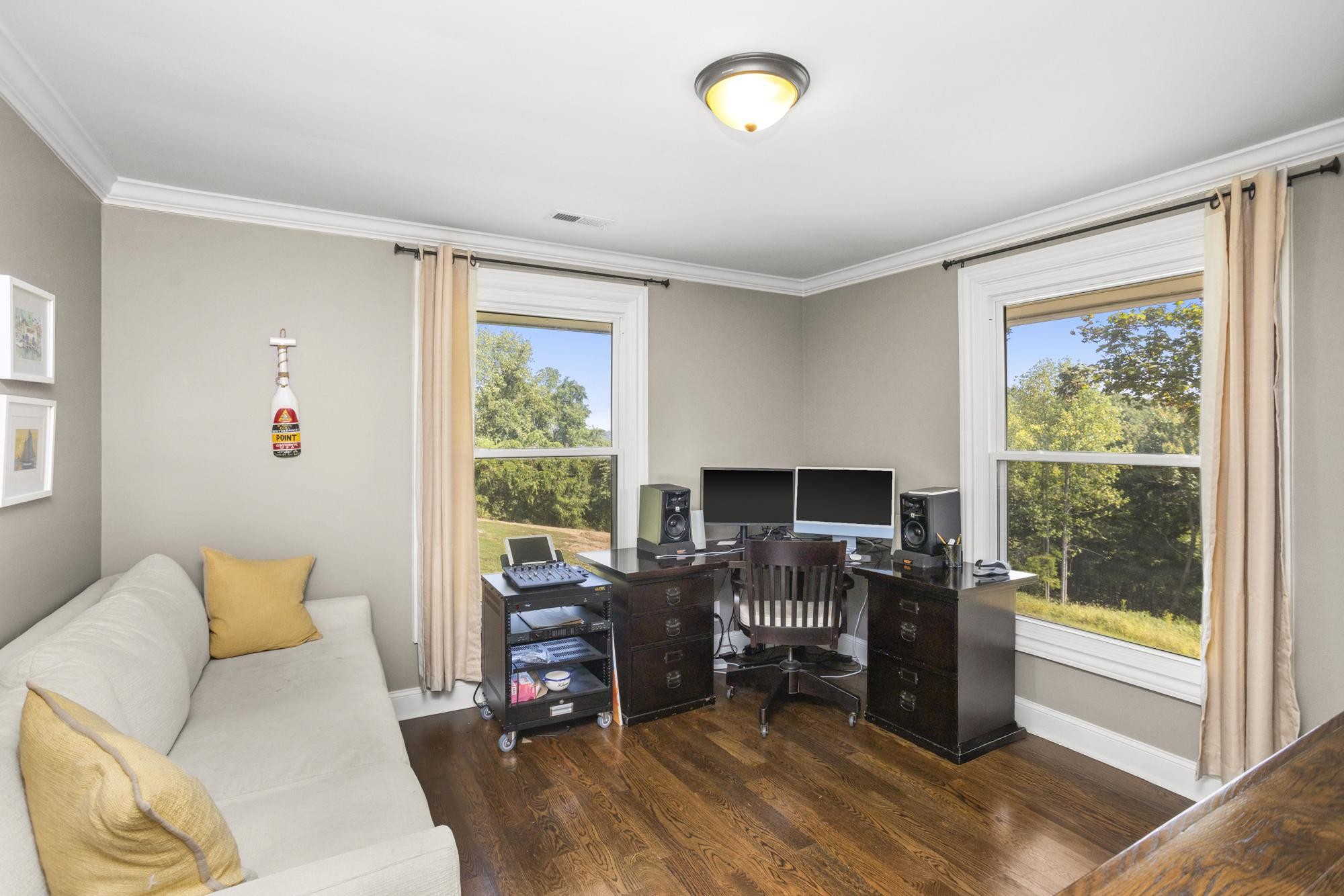8733 Haselton Road Nashville, TN 37221 - Photo 22 of 29 a view of a livingroom with workspace and a window