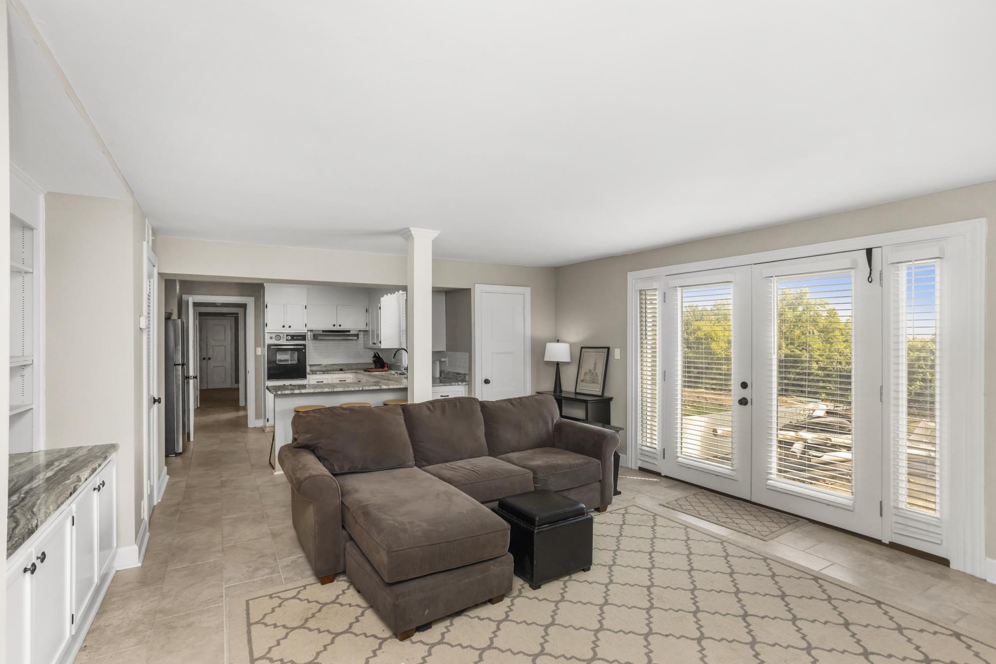 8733 Haselton Road Nashville, TN 37221 - Photo 26 of 29 a living room with furniture and a large window
