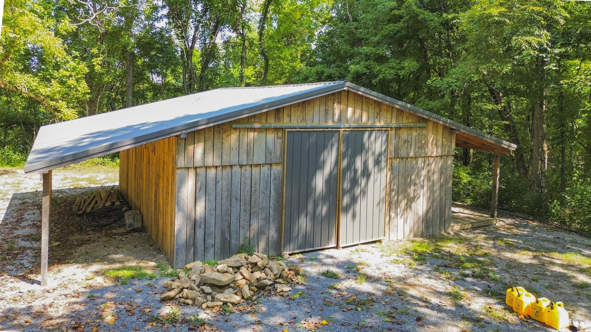 8733 Haselton Road Nashville, TN 37221 - Photo 27 of 28 a backyard of a house with lots of green space