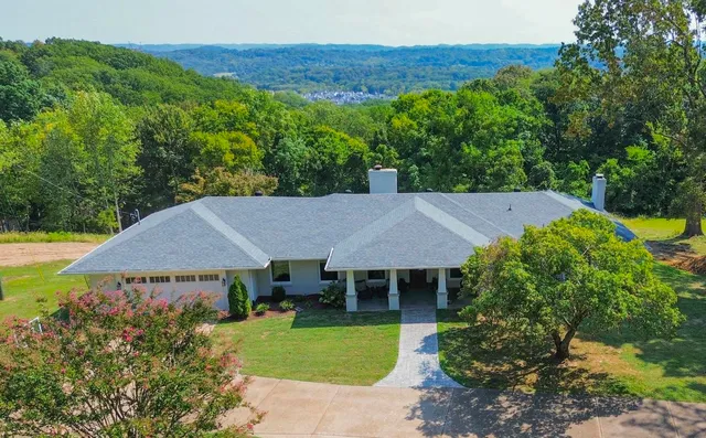 a view of a house with a garden