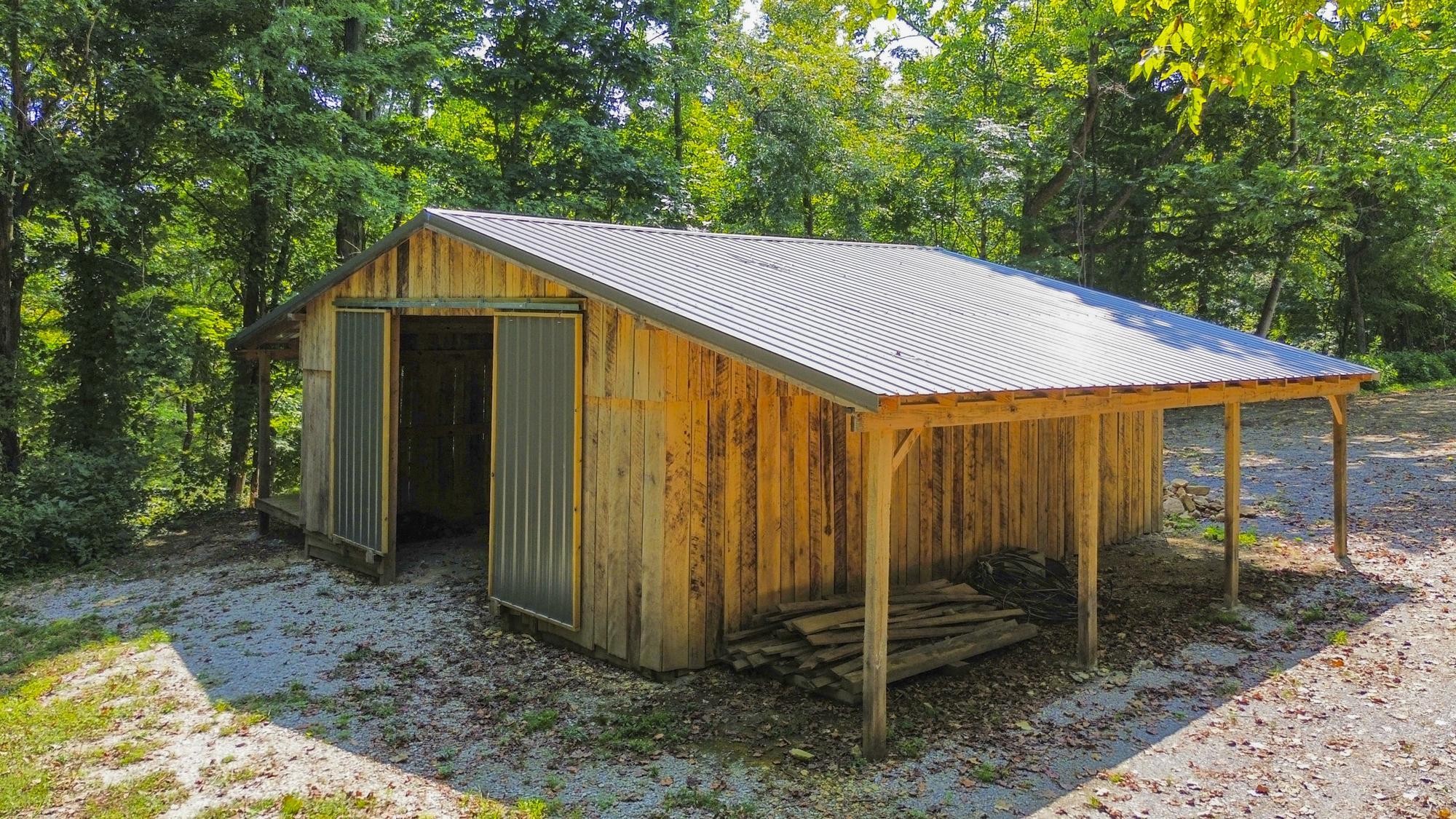 8733 Haselton Road Nashville, TN 37221 - Photo 5 of 29 a view of a house with backyard