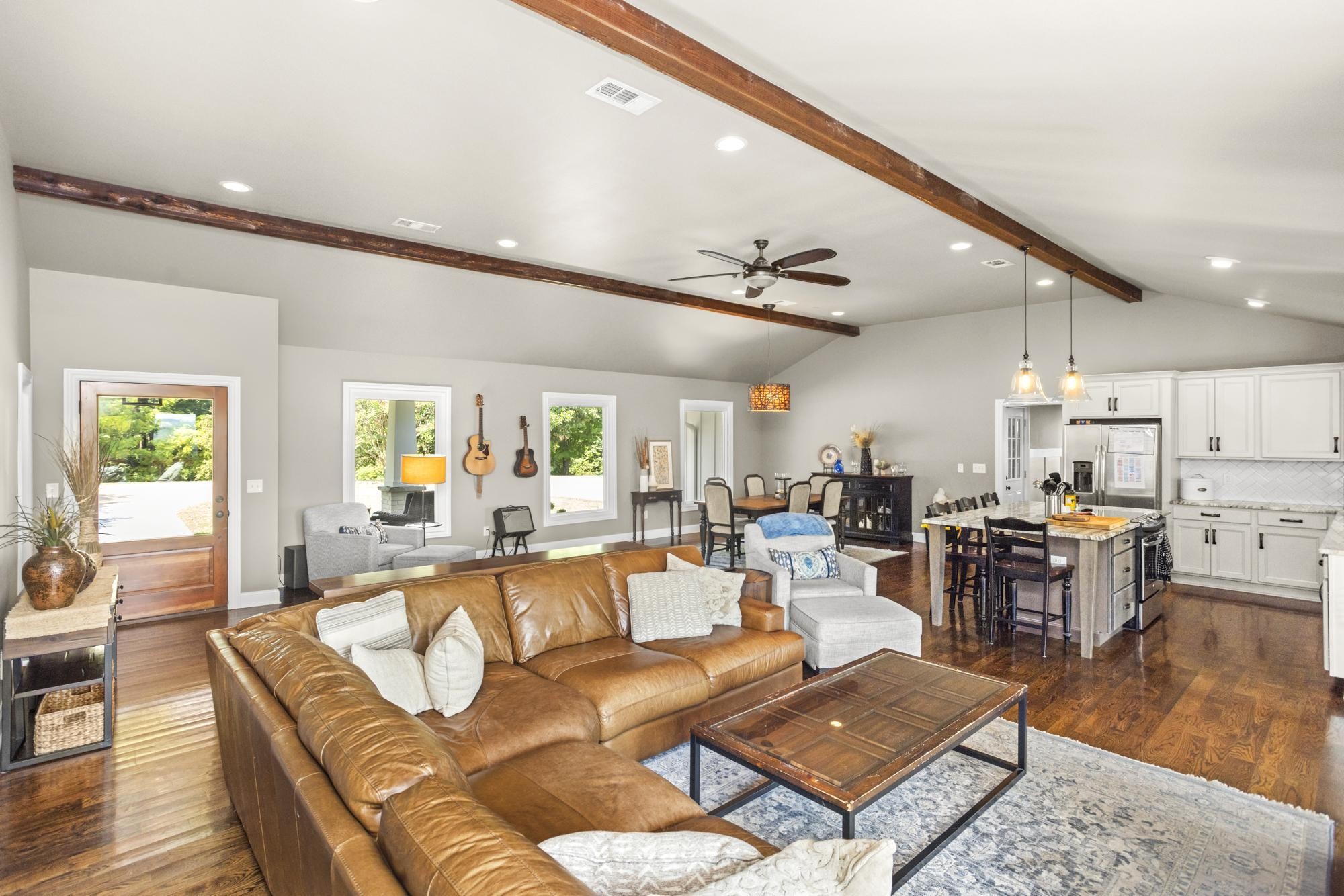 8733 Haselton Road Nashville, TN 37221 - Photo 6 of 29 a living room with furniture kitchen view and a large window