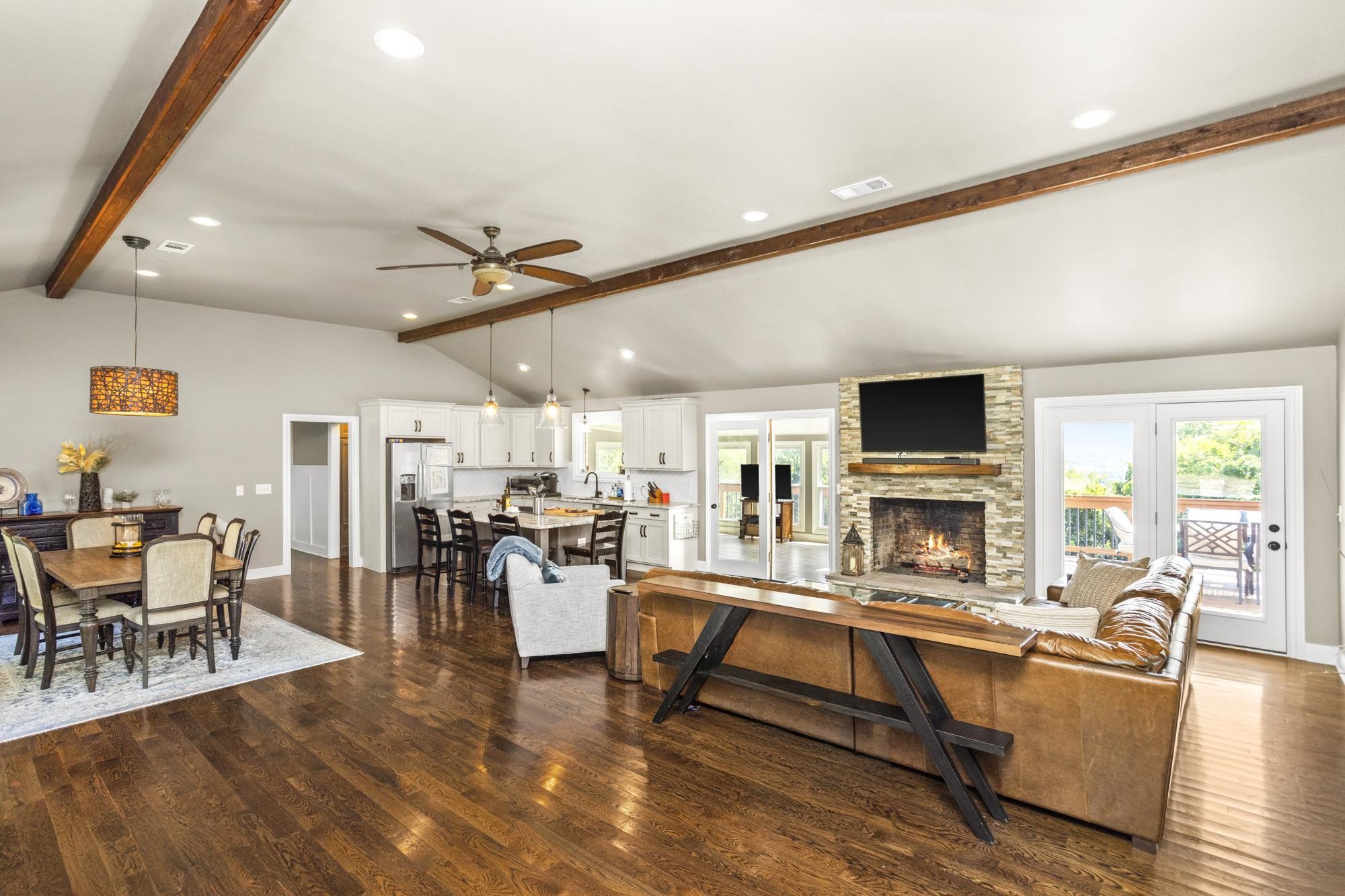 8733 Haselton Road Nashville, TN 37221 - Photo 7 of 29 a living room with furniture and a fireplace with wooden floor
