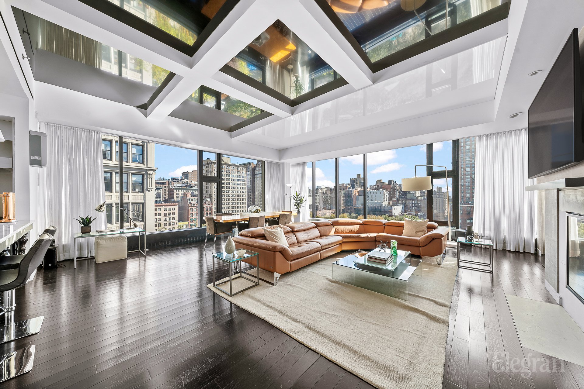 15 Union Square West, Unit 30 Manhattan, NY 10003 - Photo 1 of 17 a living room with furniture and a large window