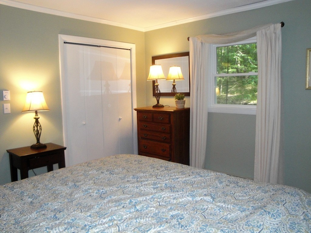 7 Carey Road Sturbridge, MA 01566 - Photo 16 of 27 a bedroom with a bed and a dresser