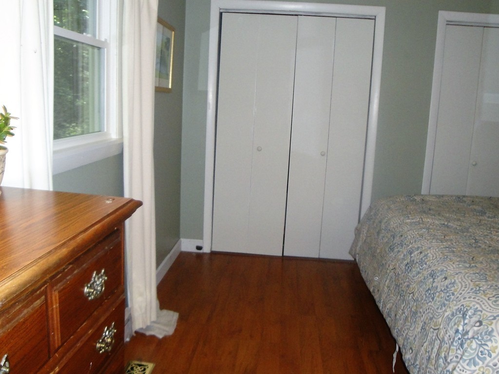 7 Carey Road Sturbridge, MA 01566 - Photo 17 of 27 a bedroom with a bed and a table