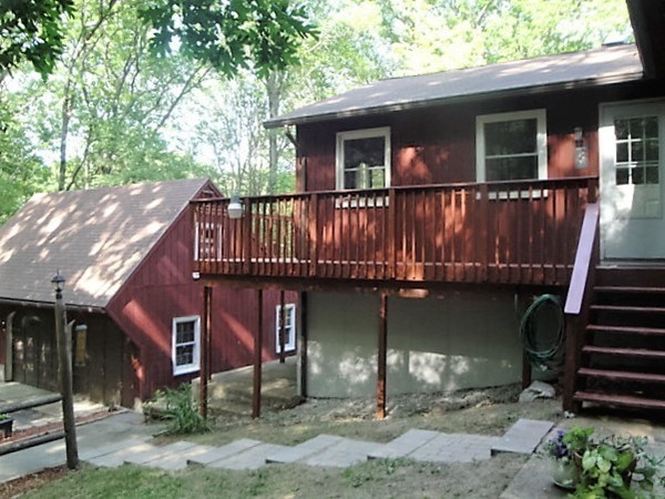 7 Carey Road Sturbridge, MA 01566 - Photo 26 of 27 a front view of a house with garden