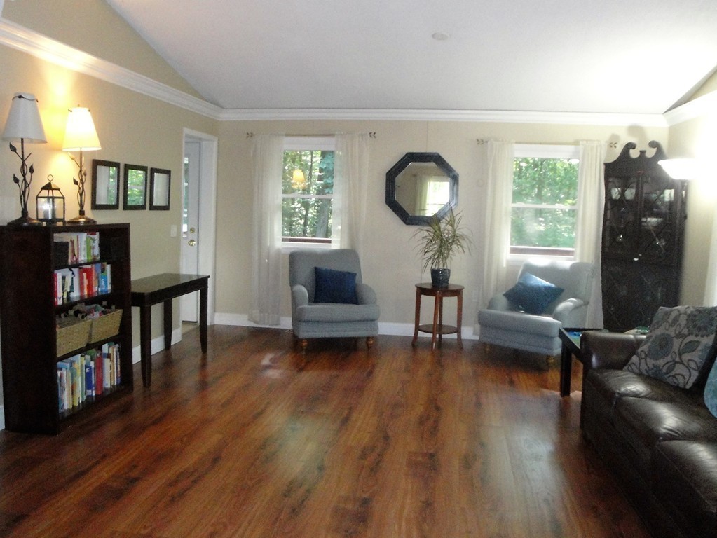 7 Carey Road Sturbridge, MA 01566 - Photo 8 of 27 a living room with furniture and a book shelf