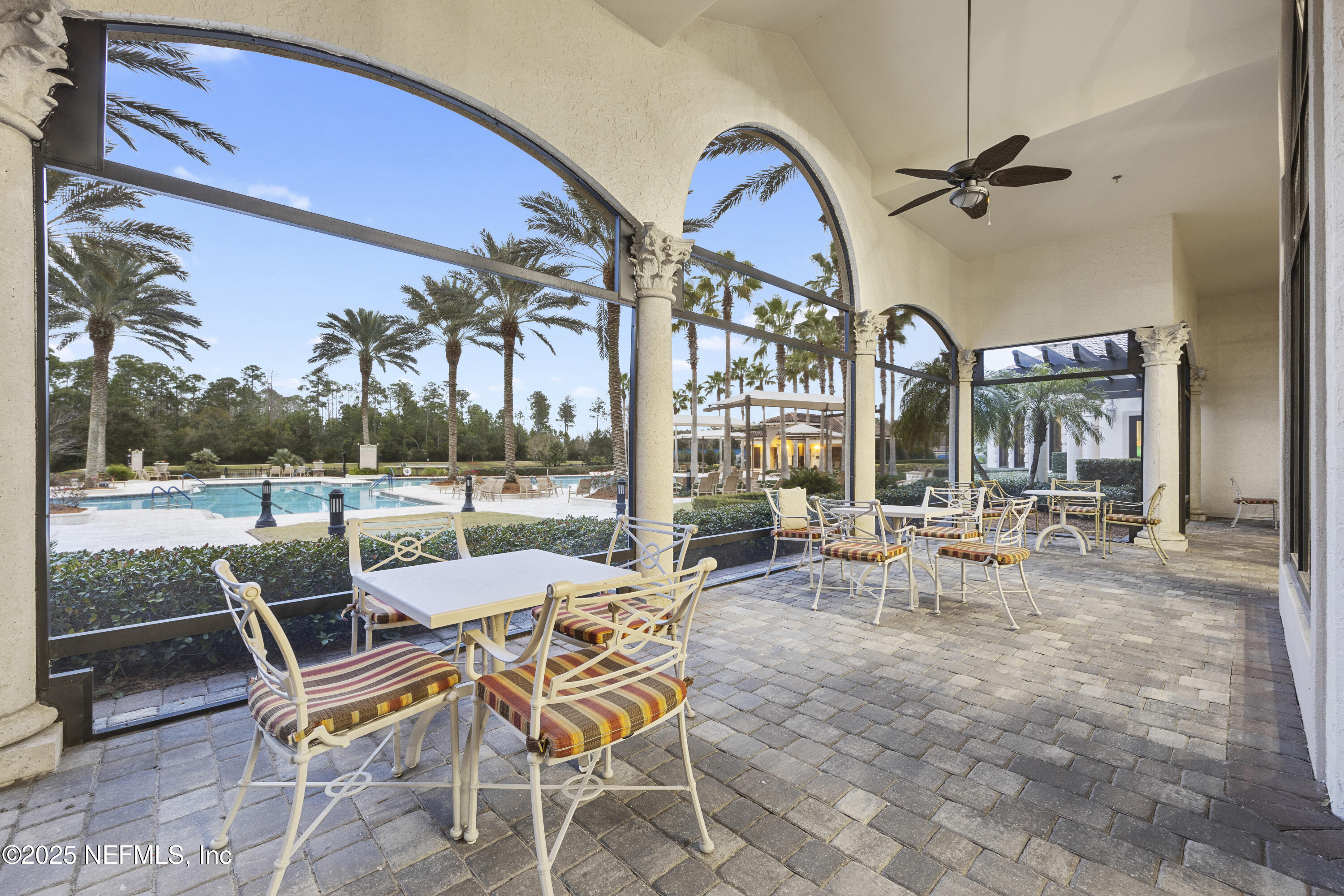 780 Wandering Woods Way Ponte Vedra, FL 32081 - Photo 75 of 109 a view of a swimming pool with chairs and tables