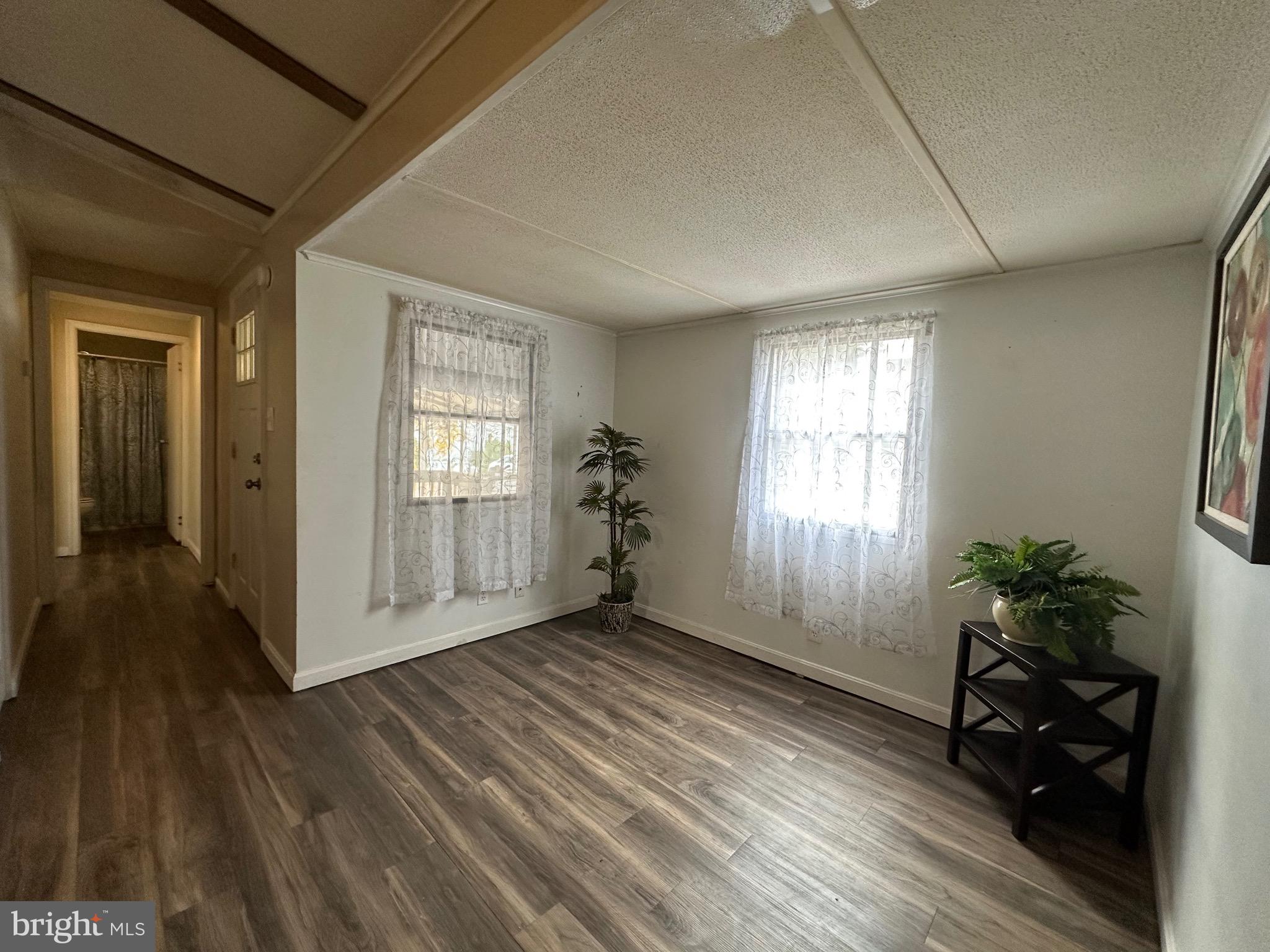 3532 Wagon Train Road Middle River, MD 21220 - Photo 9 of 28 wooden floor in an empty room with a window