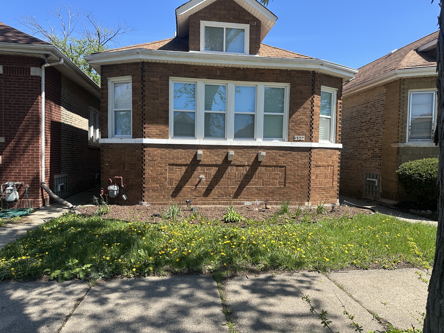 9327 South Elizabeth Street Chicago, IL 60620 - Photo 1 of 18 a front view of a house with garden