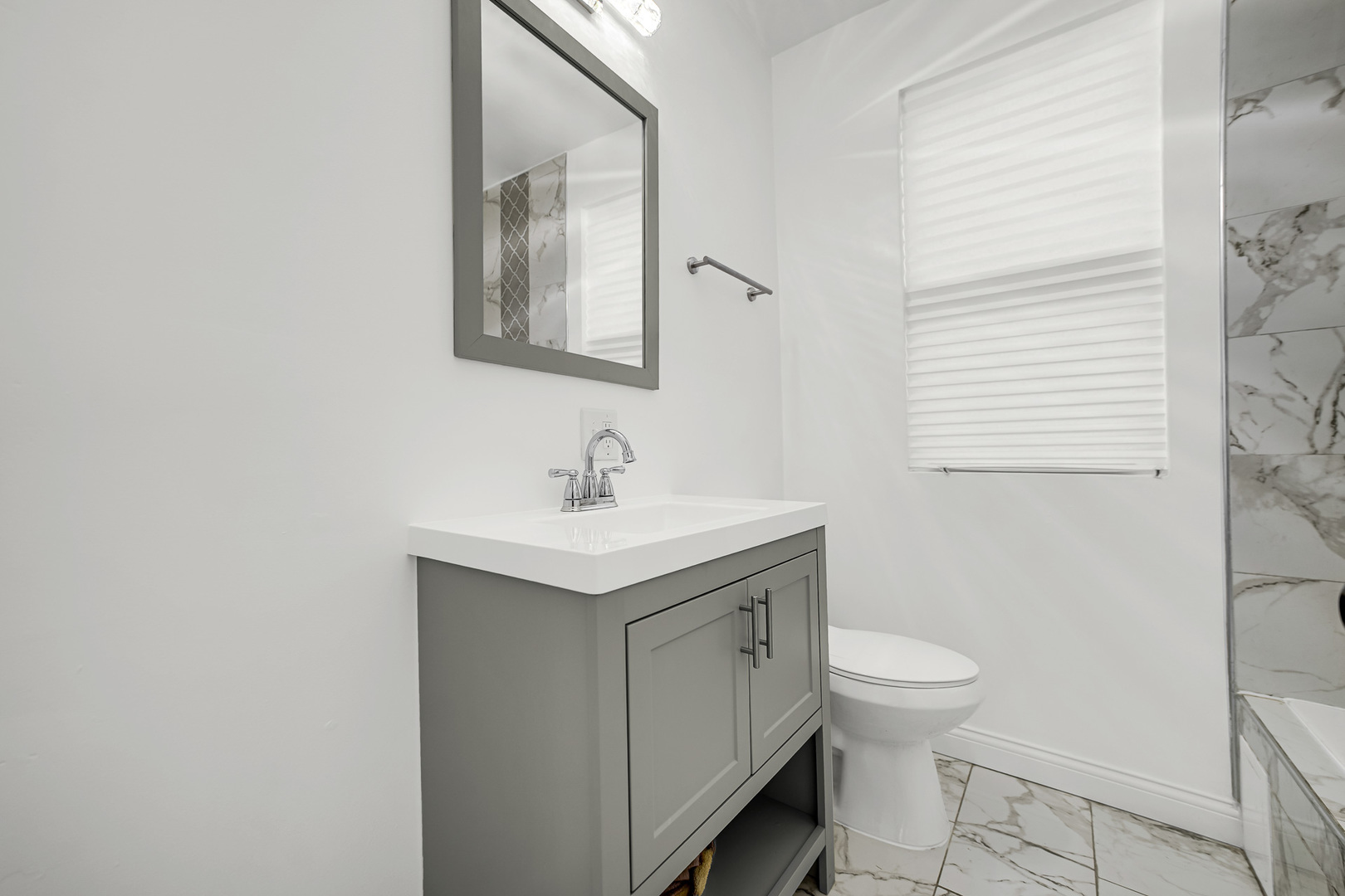 9327 South Elizabeth Street Chicago, IL 60620 - Photo 12 of 18 a bathroom with a sink toilet and mirror