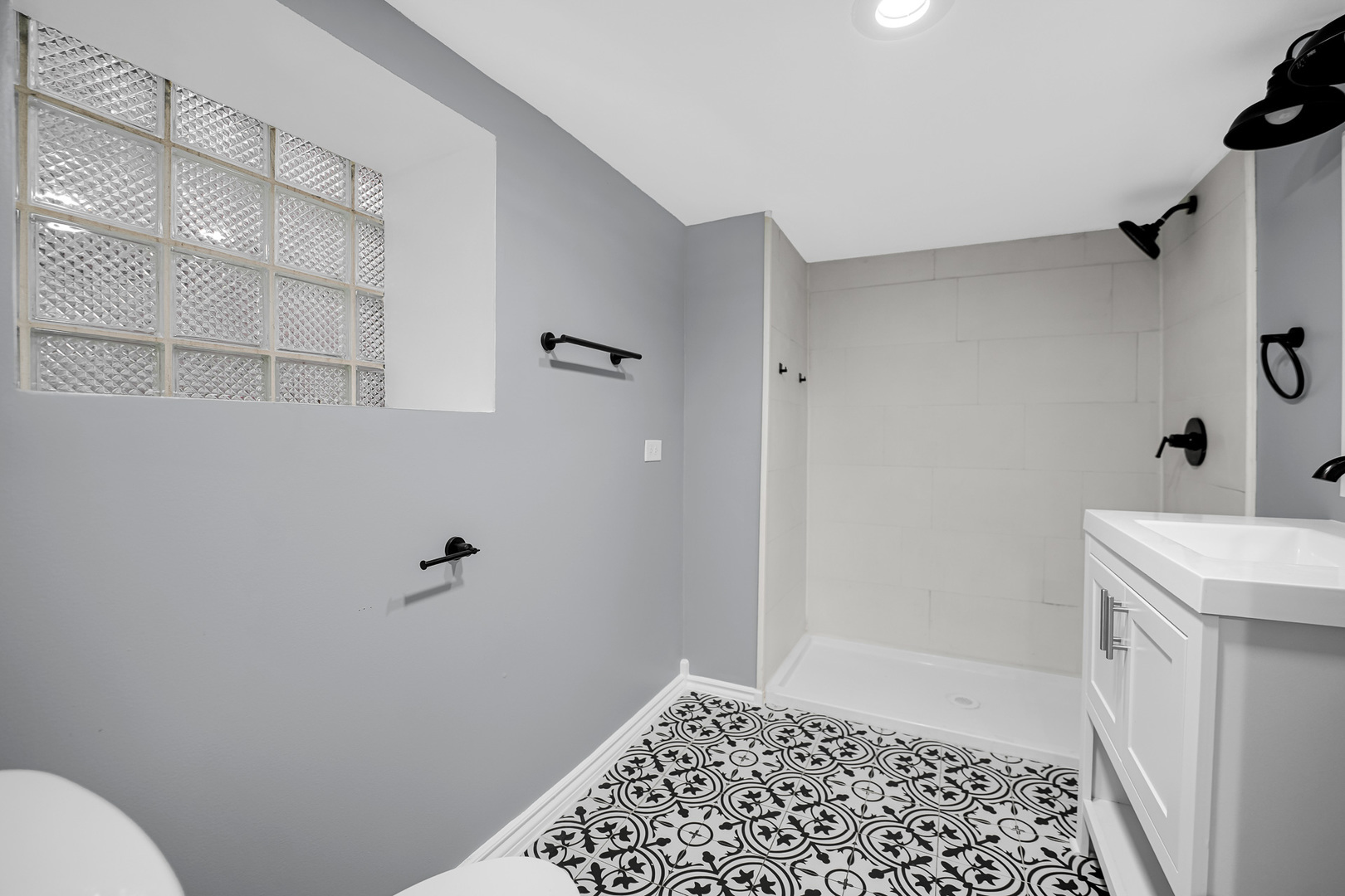 9327 South Elizabeth Street Chicago, IL 60620 - Photo 18 of 18 a bathroom with a sink a toilet and shower