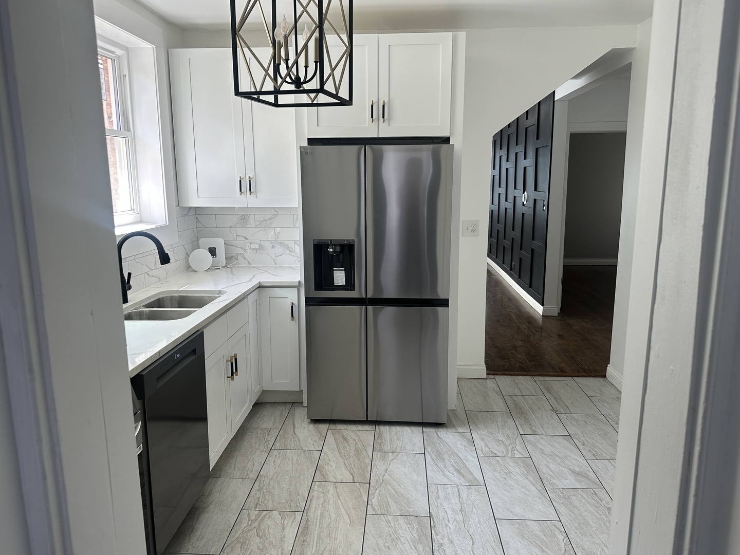 9327 South Elizabeth Street Chicago, IL 60620 - Photo 6 of 18 a kitchen with a sink a refrigerator and cabinets