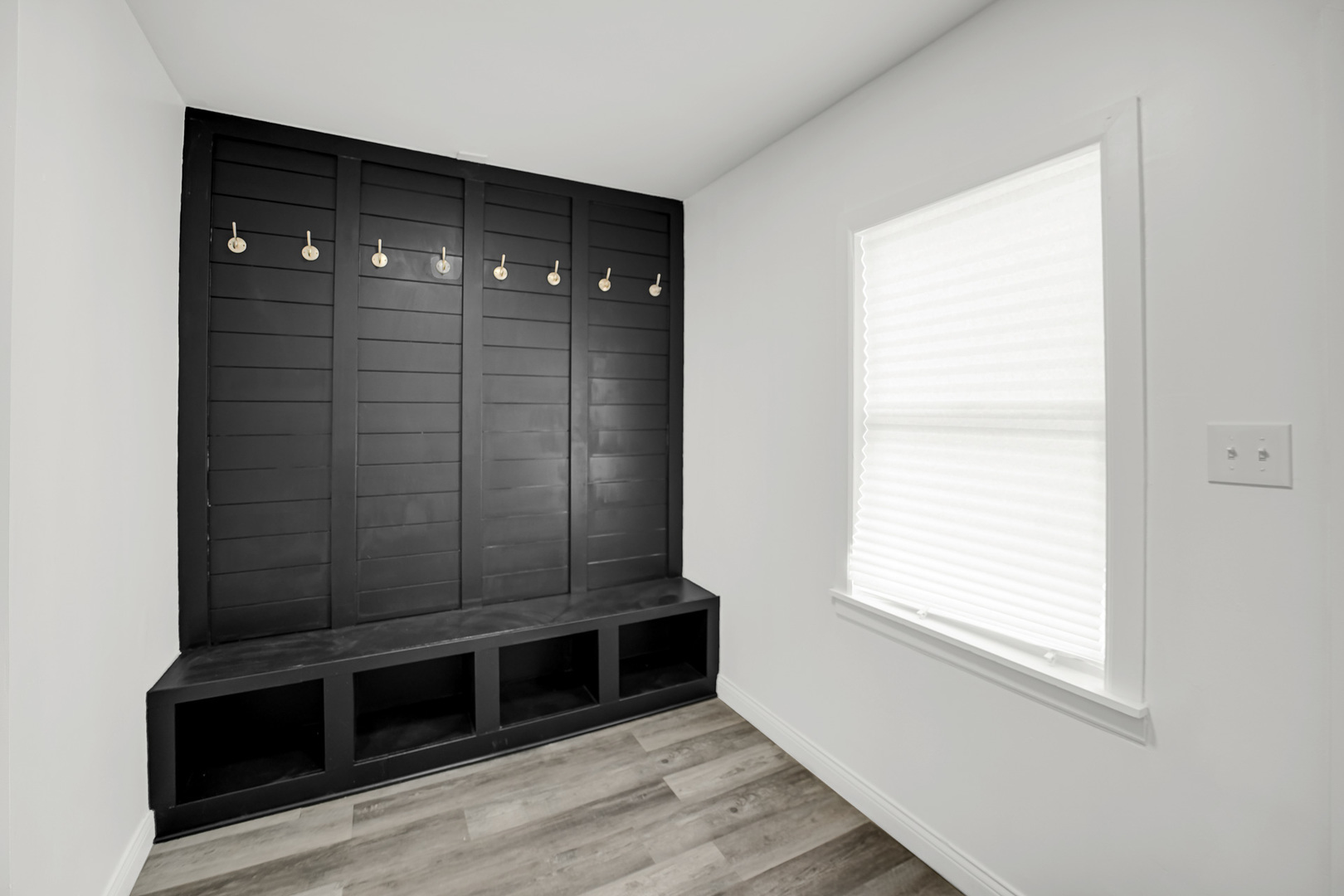 9327 South Elizabeth Street Chicago, IL 60620 - Photo 8 of 18 a view of an empty room with wooden floor and a window