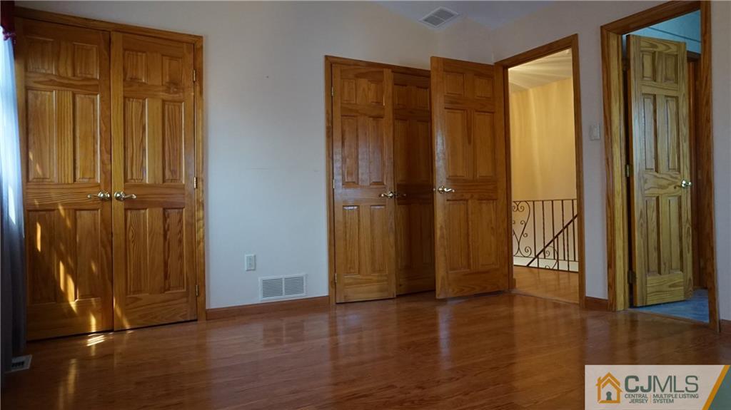 8 Plumstead Road Sewell, NJ 08080 - Photo 13 of 25 an empty room with wooden floor